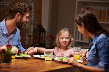 Family eating dinner at a dining table