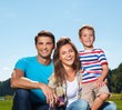 © Nejron Photo - Happy young family with their child outdoors