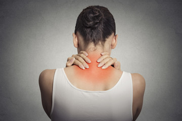 back spine disease. closeup view tired female massaging her neck
