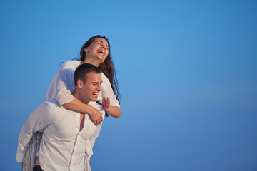 Wall Mural - happy young romantic couple have fun arelax  relax at home