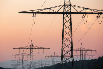  german high voltage pylons in an evenign sundown