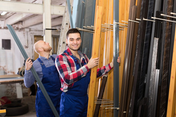 Wall Mural - workmen inspecting window frames