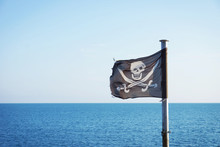 Pirate Flag Fluttering In The Sea Breeze