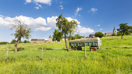 Wall Mural - Trailer On Meadow And Village