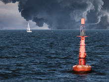 Red Buoy On Water In A Stormy Day.