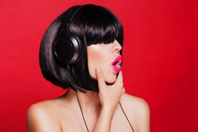 Woman Listening To Music On Headphones Enjoying A Singing