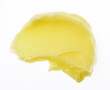 Yellow color skincare balm on background