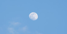 The Full Moon In The Sky During The Day.