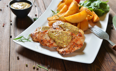 Wall Mural - Turkey breasts with honey-mustard sauce