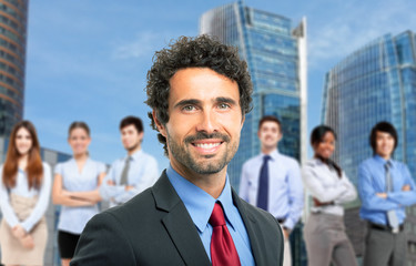 Businessman in front of his team