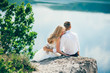 © jul14ka - beautiful young couple posing on the rock near the lake