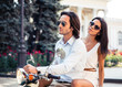 © Drobot Dean - Portrait of a beautiful couple on scooter