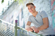 Portrait of smiling male teenager in the urban city