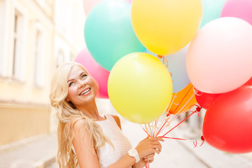 Wall Mural - smiling woman with colorful balloons