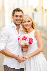 Wall Mural - couple with flowers in the city