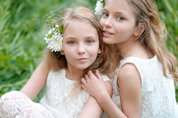 Sticker - Portrait of two little girls twins