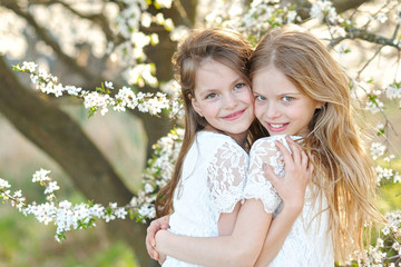 Wall Mural - Portrait of two little girls girlfriends spring