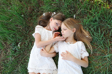 portrait of two little girls girlfriends spring