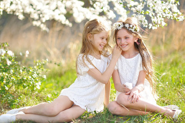 portrait of two little girls girlfriends spring