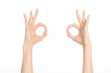 Hand gestures theme: the human hand shows gestures isolated on white background in studio