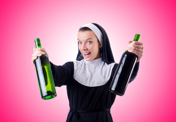 Wall Mural - Nun with bottle of red wine