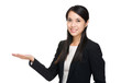 © leungchopan - Asian businesswoman with hand showing blank sign