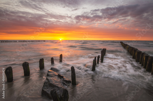 Obraz w ramie sunset over the sea beach 