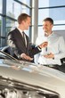 © Photographee.eu - Car dealer giving client keys