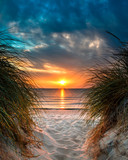 Fototapeta Zachód słońca - Personal Paradise on a Beautiful White Sand Beach at Sunset
