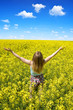 © vencav - Young happy woman on blooming rapeseed field in spring