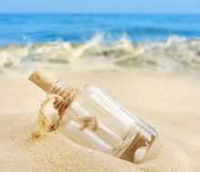 A Letter In A Bottle On The Beach