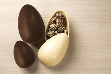 Wall Mural - Chocolate Easter Eggs Over Wooden Background