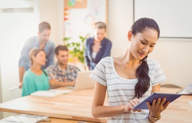 Wall Mural - Businesswoman using tablet in the office