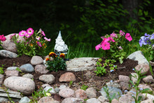 Flowerbed In A Garden Of Flowers, Embellished With Stones And Dw