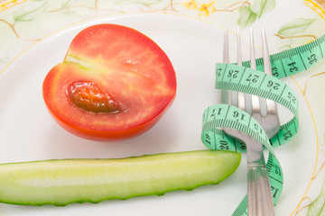 Cucumber and tomato with measuring