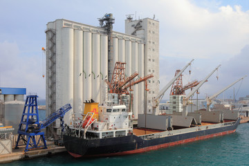 elevator and bulk carrier with grain, seaport. savona, italy