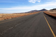 © lcswart - Empy Rural Asphalt Road Leading into Hills