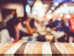 Wall Mural - empty wood table and blurred cafe light background. business pre