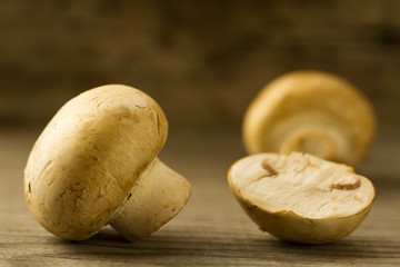 fresh mushrooms on wooden background, close-up