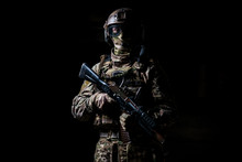 Soldier In Camouflage Hold Machine Gun