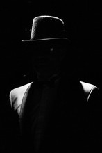 Silhouette Of A Man With A Hat On A Black Background