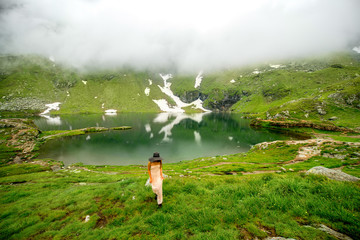 Wall Mural - Woman on the mountain lake