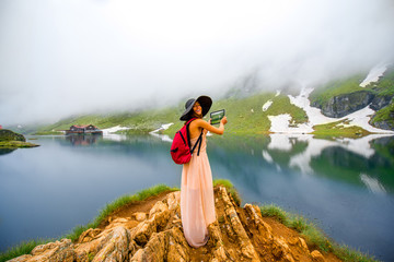 Wall Mural - Traveler on the mountain lake