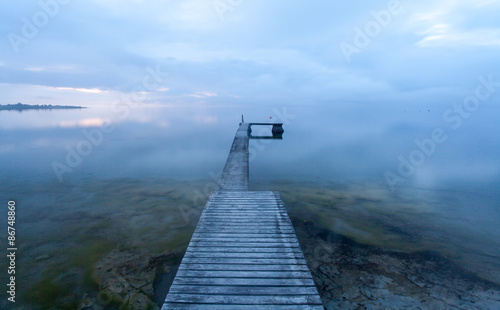 Optical illusion, a bathing jetty seem to float in the air when the sea meets...