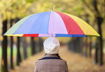 Fashion woman holding a umbrella at the park