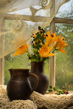 Orange Lily Bouquet On A Window Sill
