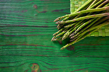 Wall Mural - green asparagus fresh on wood table