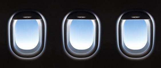 Wall Mural - airplane window and Fantastic soft white clouds against blue sky