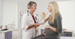 © rocketclips - Friendly doctor talking with pregnant woman