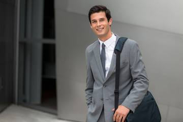 Business executive young adult successful smiling corporate working man handsome portrait